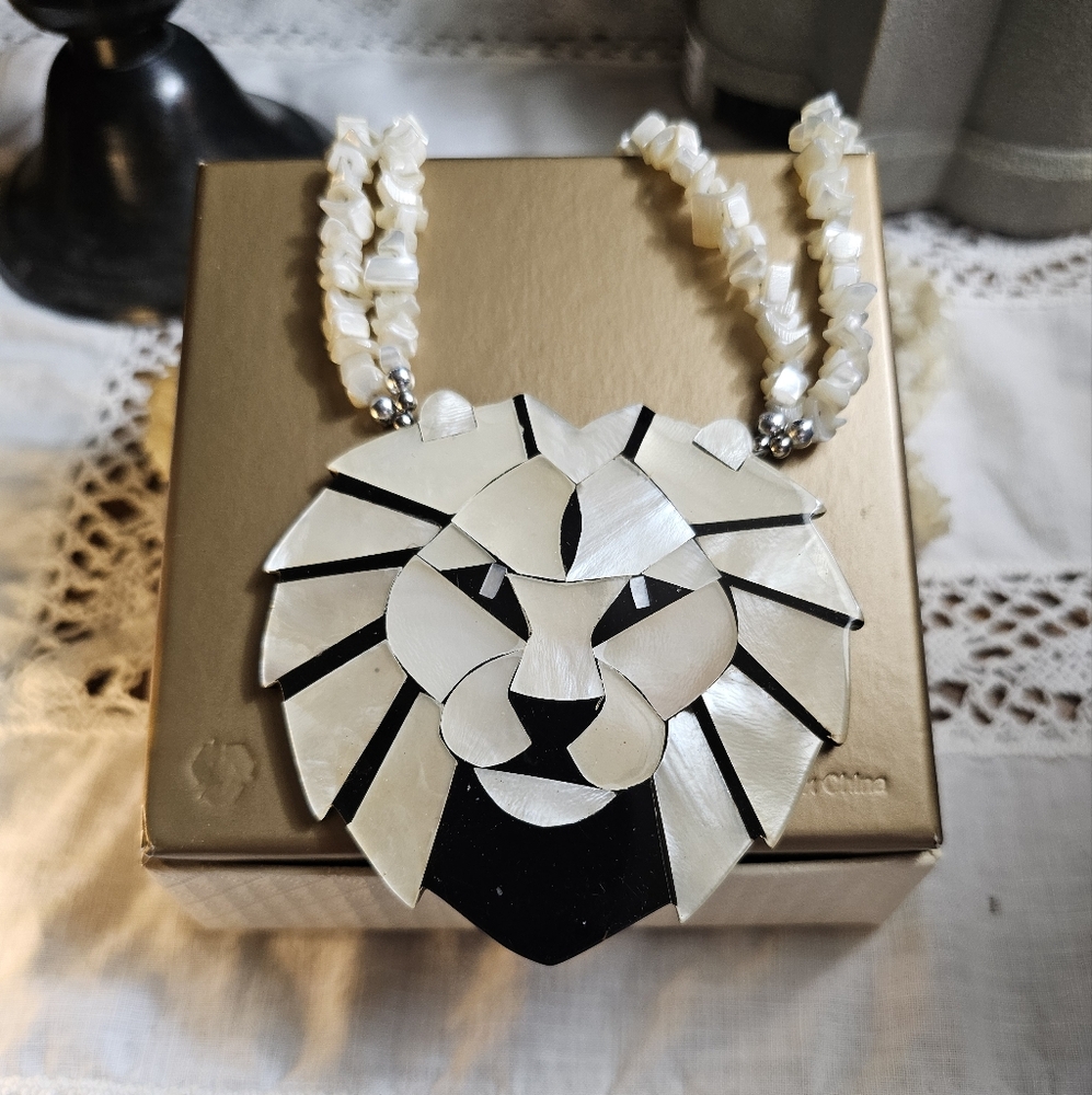Vintage Lee Sands Mother of Pearl Lion's head necklace,earrings, and bracelet.